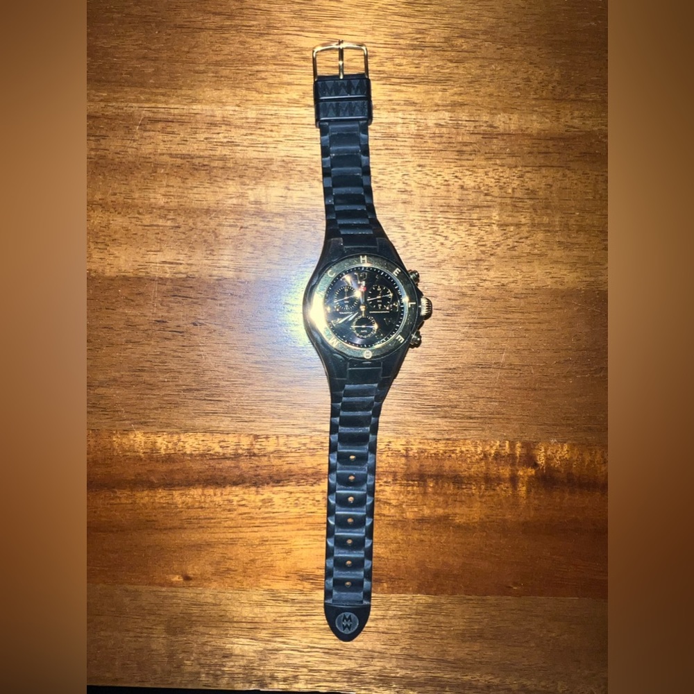 Women’s black Michele watch.